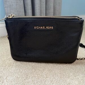 Michael Kors Black Leather Crossbody Bag with Gold Accents and adjustable strap